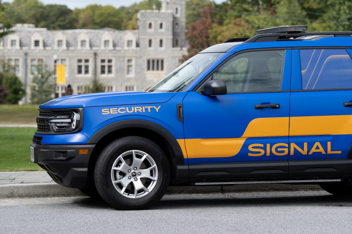 Signal Security marked blue SUV patrol vehicle